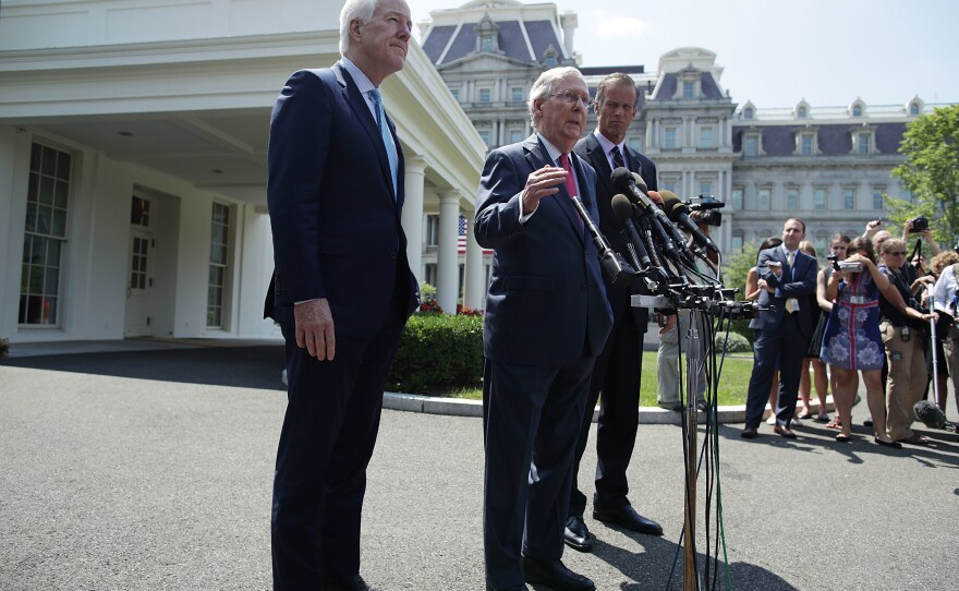 Senate Majority Leader Mitch McConnell, R-Ky. (center), speaks to members of the media with Senate Majority Whip John Cornyn, R-Texas, (left) and Sen. John Thune, R-S.D., outside the West Wing of the White House after a lunch meeting with President Trump on Wednesday.