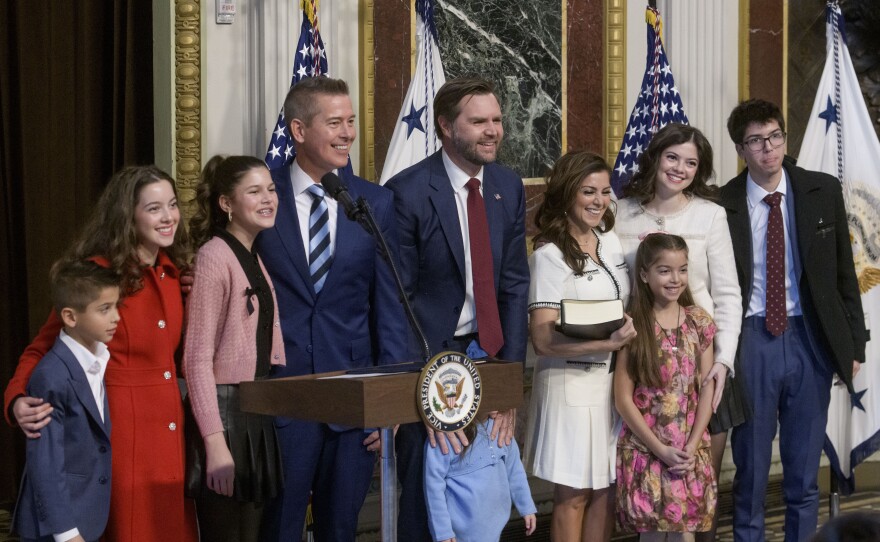 Duffy poses with his wife, Rachel Campos-Duffy, and some of their children after being sworn in by Vice President Vance in January 2025.