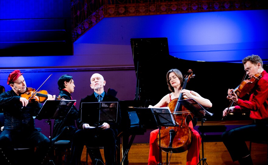 The cast of <em>The Music Critic</em>, starring John Malkovich (center) as the critic.