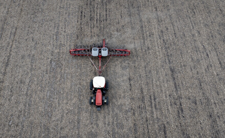 In this aerial view, Dan Duffy uses a tractor to plant soybeans on land he farms with his brother on April 28, 2025 near Dwight, Illinois.