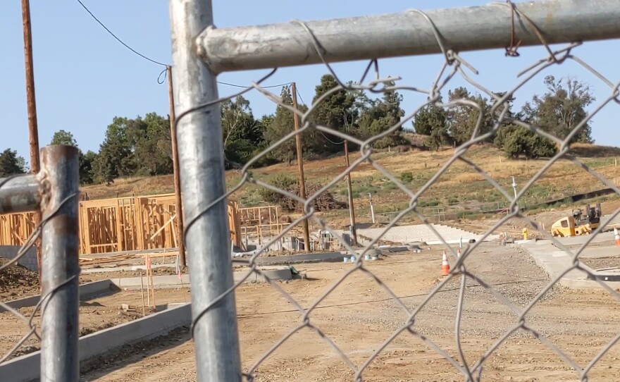 The Millenium PQ project under construction next to the defunct DoubleTree Golf Resort where the newly approved Junipers project will be built, June 17, 2021.