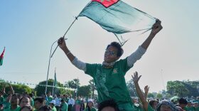 Supporters of the military-backed Union Solidarity and Development Party wave the party flags during the first day of campaigning for the general election, in Naypyitaw, Myanmar, Oct. 28.