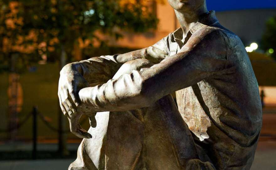 A life-size young Ike looks over at the statues depicting his future. Sculpture by Sergey Eylanbekov.