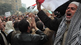 Anti-government demonstrators chant slogans for freedom in Tahrir Square on February 7, 2011 in Cairo, Egypt. 