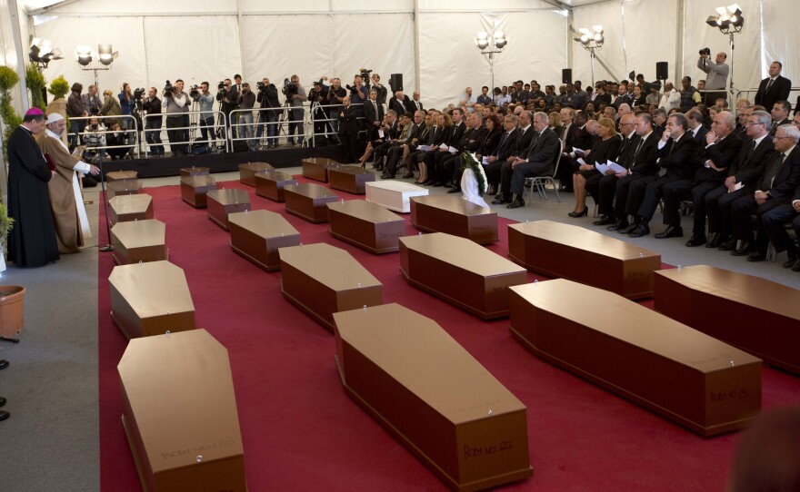 A funeral service for 24 migrants who drowned while trying to reach the southern coasts of Italy, in April. The migrants died as a smuggler's boat crammed with hundreds of people overturned off the coast of Libya.