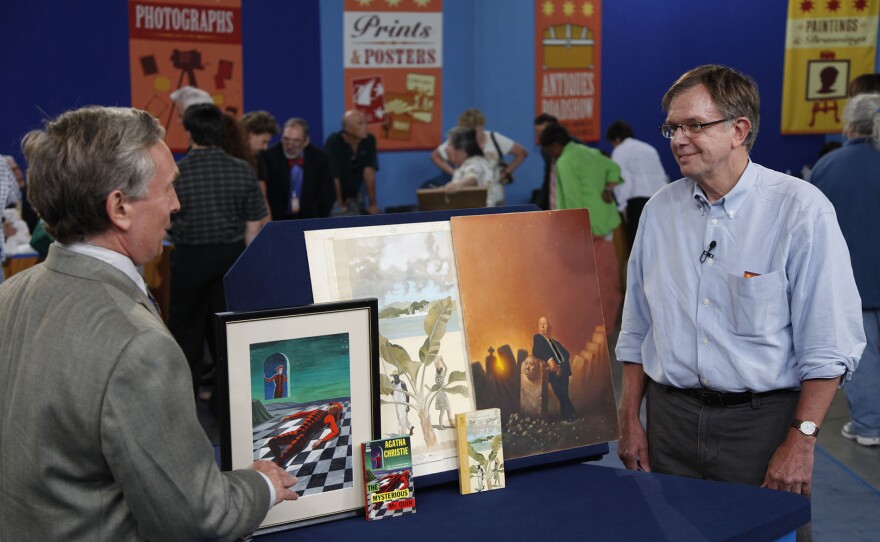 Ken Gloss (left) appraises vintage paperbacks &amp; original cover art in Raleigh, NC. ANTIQUES ROADSHOW “Vintage Raleigh 2025, Hour 2” airs Monday, October 6 at 8/7C PM on PBS. 