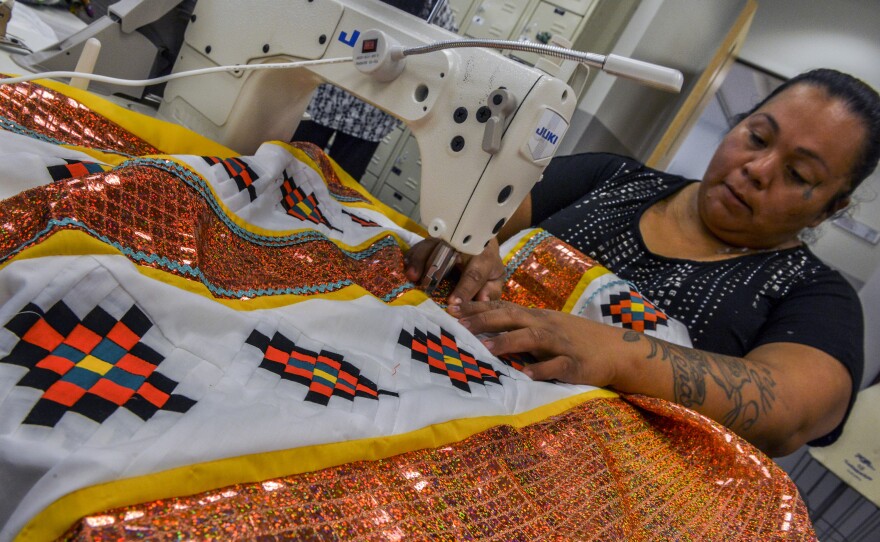 Tammy Billie works on a personal garment using her two favorite colors in the Art and Culture Center on July, 24, 2015 at Seminole Tribe of Florida headquarters in Hollywood. There are many patchwork competitions among tribal members. It's sold at nearly all tribal fairs, too.