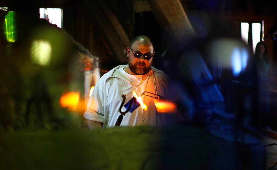 Glass blower Ron Rogers works in a replica factory near the site of the original Jamestown kiln. He practices his craft just as the colonists did, except for using gas-fueled ovens instead of wood-fired ones.
