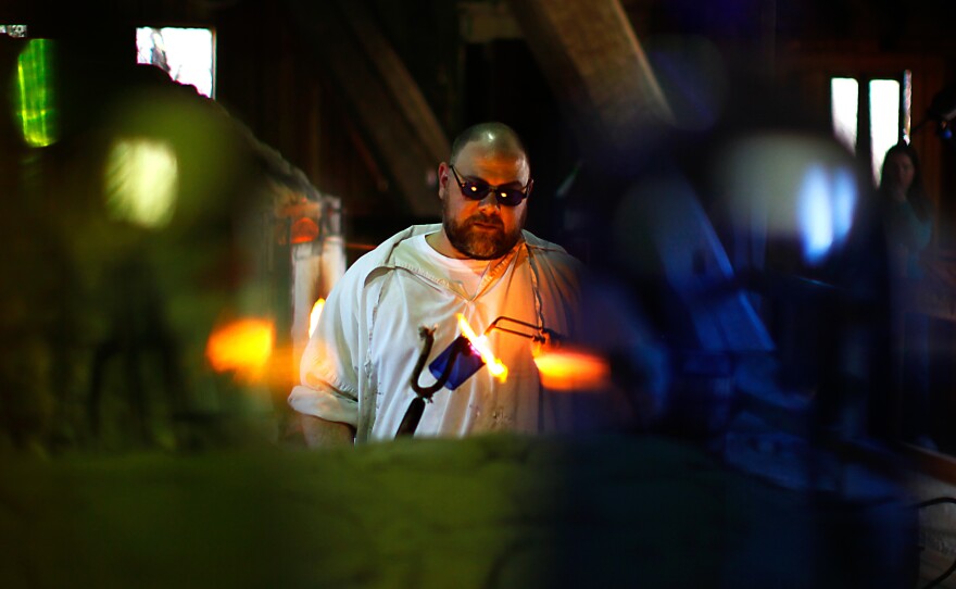 Glass blower Ron Rogers works in a replica factory near the site of the original Jamestown kiln. He practices his craft just as the colonists did, except for using gas-fueled ovens instead of wood-fired ones.