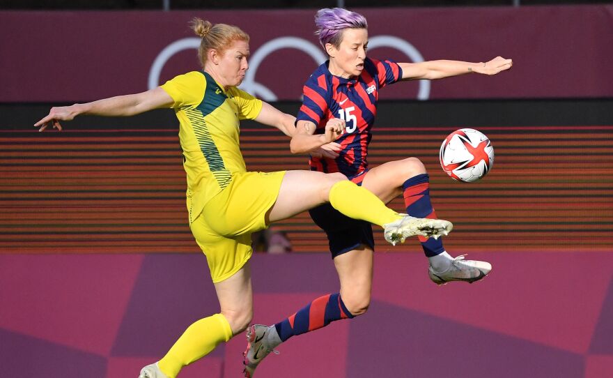 Australia's defender Clare Polkinghorne (L) fights for the ball with USA forward Megan Rapinoe during the Tokyo 2020 Olympic Games women's bronze medal soccer match on Thursday.