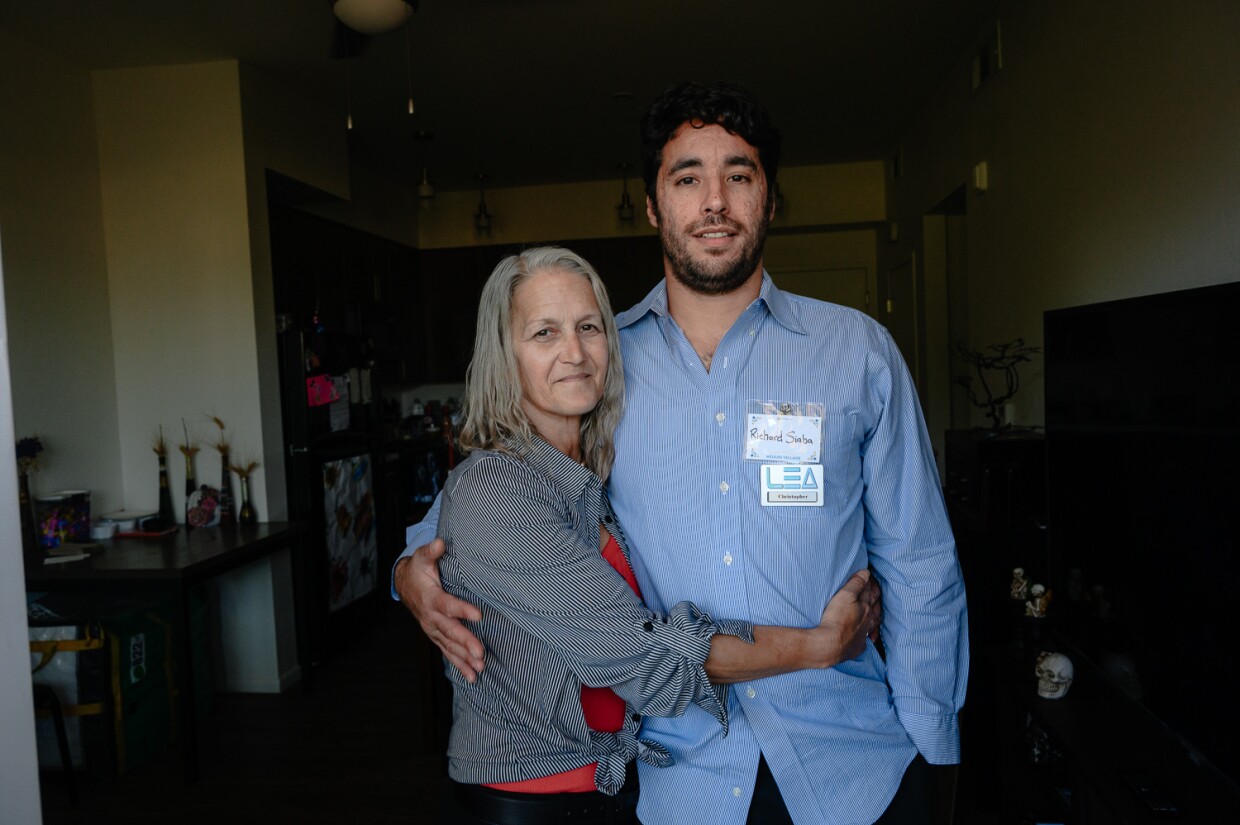 Milejo Village resident Rachel Hayes stands for a portrait with her boyfriend, Richard Siaba, inside their new apartment in San Ysidro on Nov. 2, 2023.