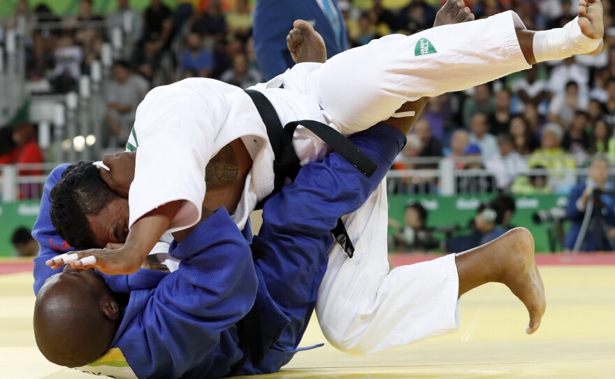 Nauru's Ovini Uera (white) competes with Belize's Renick James during their men's 90kg judo contest match in Rio on Wednesday. Uera won this match, but was eliminated in the next round.