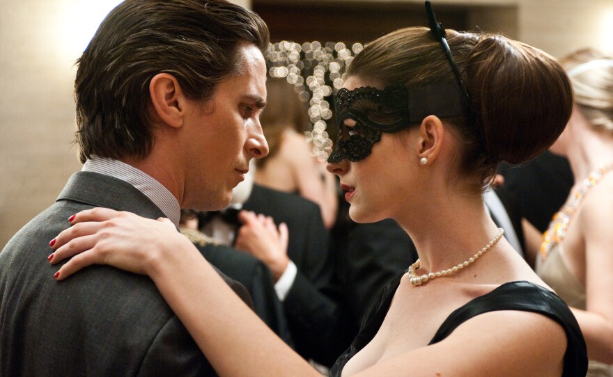 Christian Bale and Anne Hathaway as Bruce Wayne and Selena Kyle in "The Dark Knight Rises."
