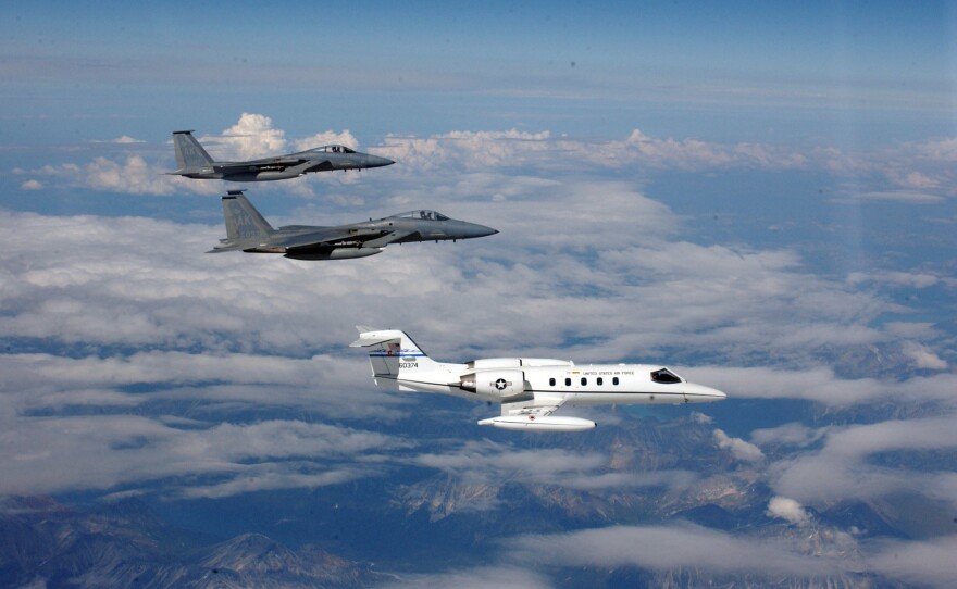 Two F-15 Eagles from Elmendorf Air Force Base, Alaska, intercept a C-21 during a homeland defense exercise in Alaska.