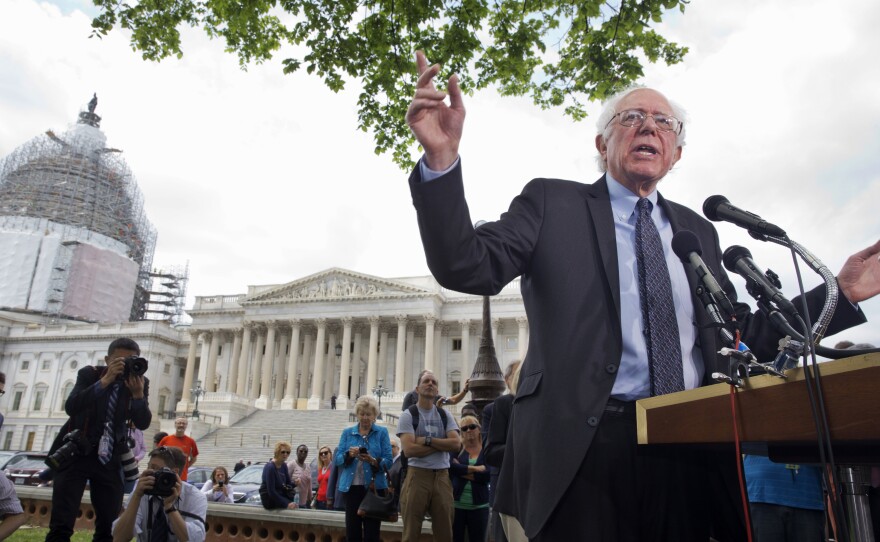 Vermont independent Sen. Bernie Sanders announces his presidential bid on April 30, 2015, on Capitol Hill in front of media members and a small group of onlookers.