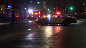 Authorities respond to the scene where a man was hit and killed by a Burlington Northern Santa Fe freight train in downtown San Diego, June 10, 2015.