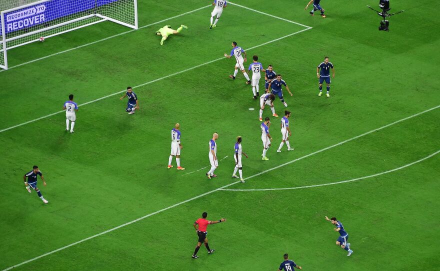 Argentina's Lionel Messi (bottom right) celebrates after scoring on a free kick against Team USA on Tuesday during their Copa America Centenario semifinal football match in Houston.