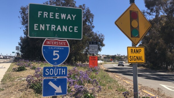 A car drives onto the onramp for the I-5 south at the Palomar Airport Road exit, March 23, 2022.