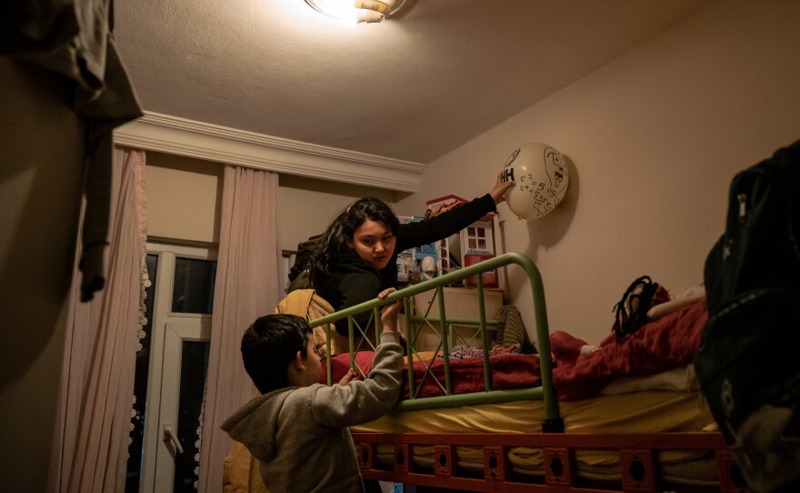 Aysu, 10, and Lütfullah play with a balloon in their bedroom in Istanbul. Aysu was only 6 years old and Lütfullah was only 4 when they were sent to separate boarding schools in Xinjiang. When they returned, they were malnourished and could no longer speak Uyghur or Turkish.