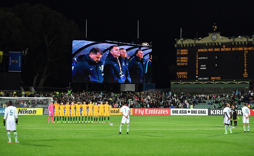 Australian Socceroos players observe a moment of silence prior to a 2018 FIFA World Cup qualifier with Saudi Arabia's national team at the Adelaide Oval in North Adelaide on Thursday.