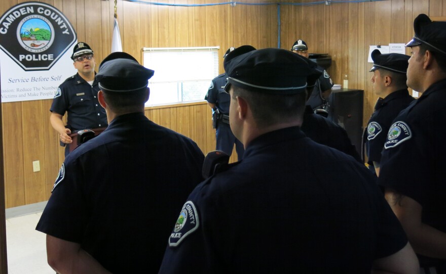 Camden County Police lineup for morning roll call at trailer used for the department's northern division office. Police Chief Scott Thomson says in addition to the downtown headquarters he wanted to extend the department out into the community with two offices located closer to where people live.