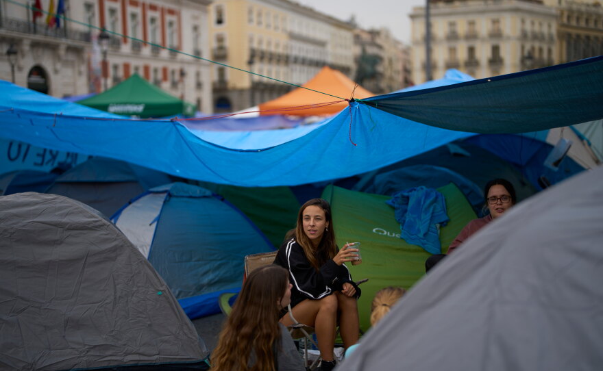 Demonstrators camp during a protest at Sol Square following the eviction last Wednesday of 87-year-old Maricarmen as they demand stronger laws to protect renters in Madrid, Spain, Monday, Sept. 28, 2026.