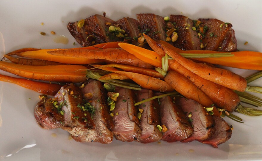 Duck breast hay-roasted carrots with toasted pistachios from chef Will Gilson.