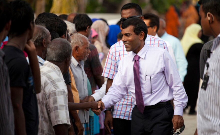 President Mohamed Nasheed greets residents of an island in the northern Maldives.