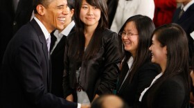 President Obama talks to the audience following a town hall meeting at the Museum of Science and Technology in Shanghai.