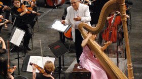 Conductor David Effron leads the University Summer Festival Orchestra while Hanako Hirano (silver medal winner) performs.