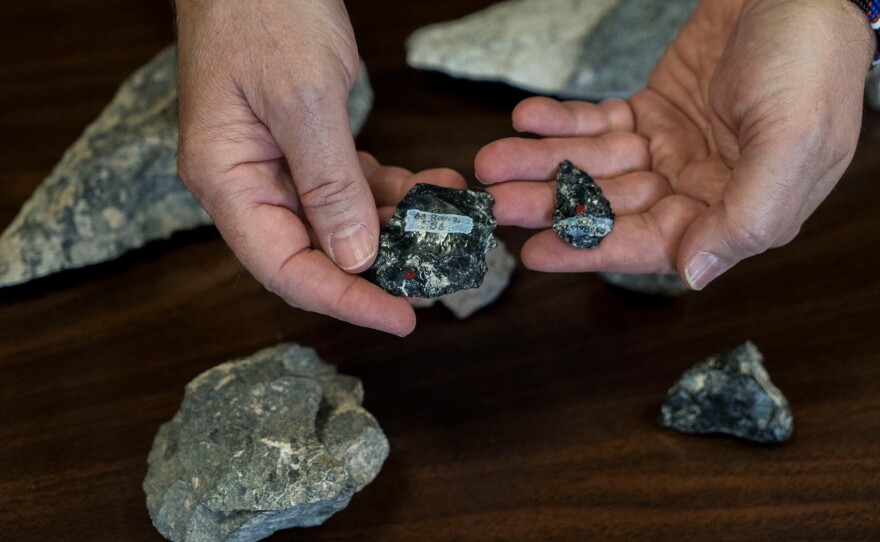 Obsidian rock found at Olorgesailie was originally brought by the ancient humans from distant places, some as far away as 50 miles from the site. Scientists think this is evidence of a larger social network of groups of ancient people who stayed in touch and exchanged obsidian and other resources.