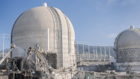 Demolition crews are working to clear the auxiliary building outside the iconic domes at San Onofre Nuclear Generating Station, Dec. 16, 2025.