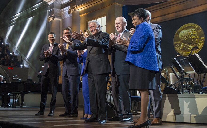 Honoree Tony Bennett at the presentation of the Library of Congress Gershwin Prize for Popular Song. Presenting Members of Congress are (l-r) U.S. Representative Kevin Yoder, U.S. House of Representatives Vice Chairman of the Joint Committee on the Library of Congress Gregg Harper, U.S. House of Representatives Democratic Leader Nancy Pelosi, U.S. Senator Patrick Leahy, and U. S. House of Representatives Majority Leader Kevin McCarthy, with Librarian of Congress Carla Hayden, far right.