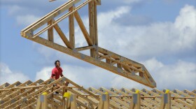  A construction worker builds a commercial complex in Springfield, Illinois, July 17, 2014. 