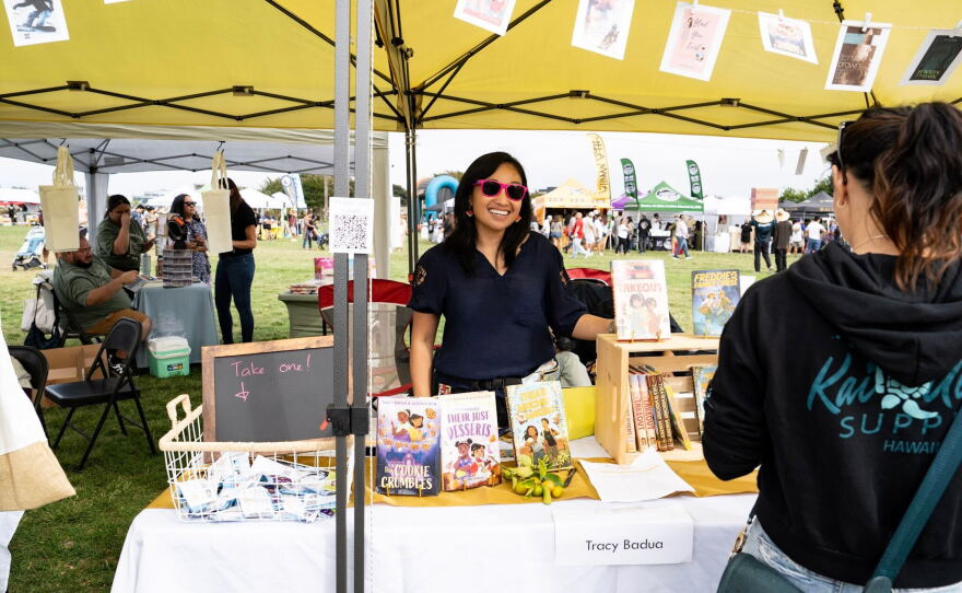 Author Tracy Badua is seen at a booth at the Filipino American Friendship Festival in this undated photo.