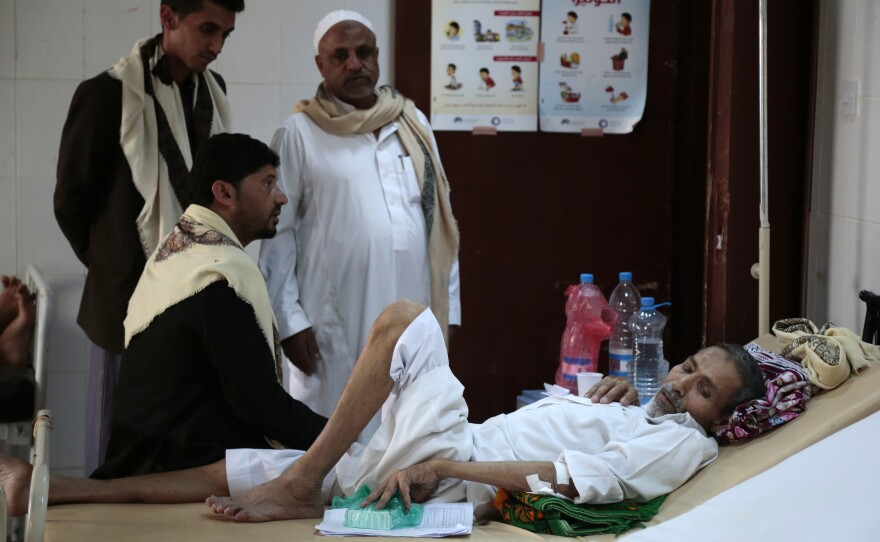 A man rests in a hospital in the capital, Sanaa, as he is treated for a suspected cholera infection earlier this month.