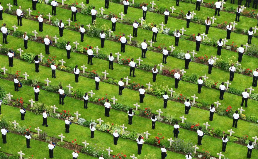 Young people lay wreaths during a service to mark the 100th anniversary of the start of the Battle of the Somme at the Commonwealth War Graves Commission Memorial on Friday in Thiepval, France.