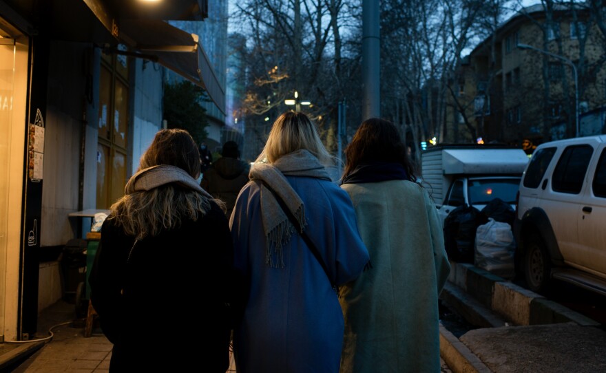 Women without headscarves stroll through Tehran's Tajrish Square in February 2023.