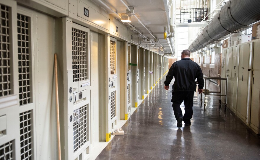 Lt. Keith Immerfall walks past prison cells at Waupun Correctional Institution, a maximum security prison in Waupun, Wis. If the more than 1,200 prisoners at the facility are still incarcerated there on April 1, the next Census Day, the Census Bureau will officially consider them residents of Waupun for the 2020 national head count.