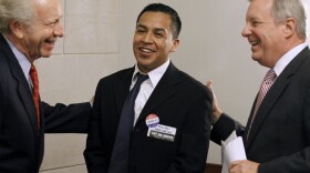 Sens. Joseph Lieberman of Connecticut (left) and Richard Durbin of Illinois (right) talk with Cesar Vargas, a law student from New York City, on Capitol Hill in September. Vargas is one of some 2 million young people who would qualify for legal residency under the DREAM Act.