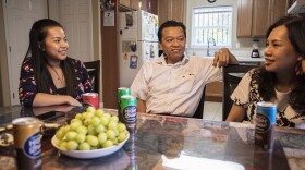 Jenny Nguyen, with her parents Khanh Nguyen and Tammy Vo, sitting in their home in Sacramento built by Habitat for Humanity in this undated photo. 