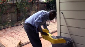San Diego County vector control technician Sean Simmons inspects a home for mosquitoes, May 23, 2018.