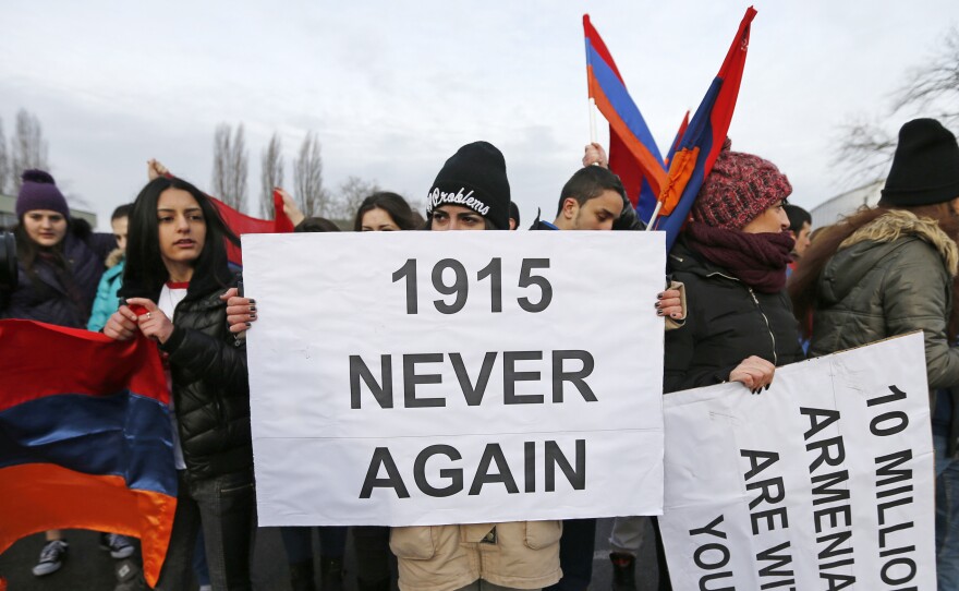 An Armenian protester holds a sign reading "1915 never again" as she takes part in a demonstration near the European Court of Human Rights in Strasbourg on January 28.