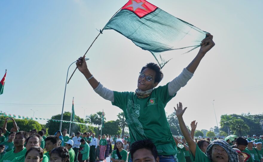 Supporters of the military-backed Union Solidarity and Development Party wave the party flags during the first day of campaigning for the general election, in Naypyitaw, Myanmar, Oct. 28.