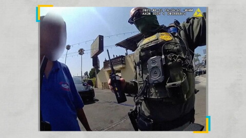 An immigration agent arrests a worker at the Hand J car wash in Los Angeles during a raid in August 2025.