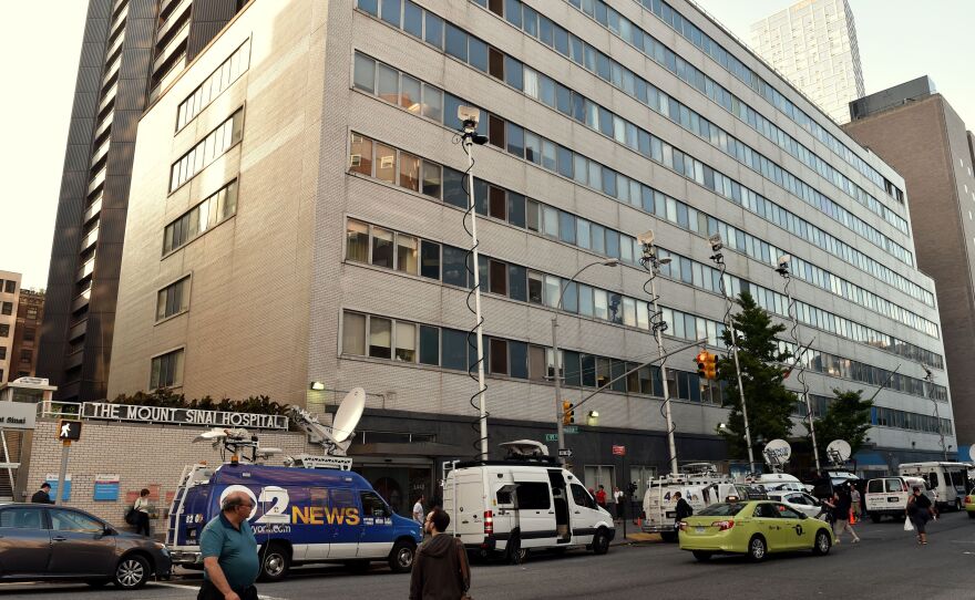 Television trucks converged on Mount Sinai Hospital in New York on Monday after it announced that it was screening a patient for Ebola virus.