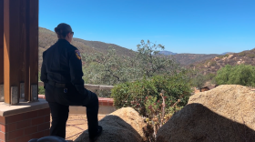 Cal Fire Forestry Technician Brandi McLaughlin surveys the open space in Jamul, California, on Aug. 19, 2025.