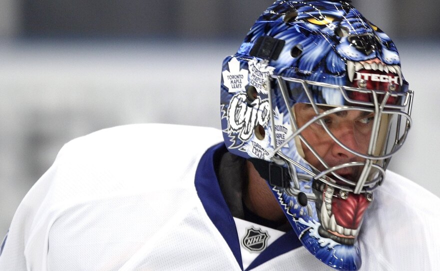 Curtis Joseph, then still playing for the Toronto Maple Leafs, warms up before a game in New York City in 2008. The word "Cujo" is scrawled on the side of this Frank Cipra-designed mask — a reference both to his nickname and Stephen King's novel about a rabid dog, here represented with maw opened wide on the front.