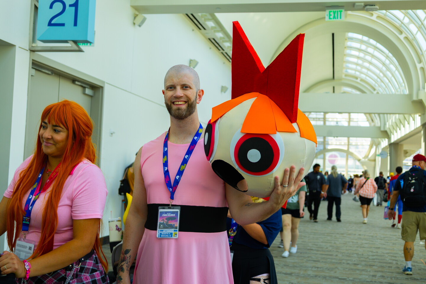 A cosplayer holds the head of his Powerpuff Girl Blossom costume during Comic-Con, July 24, 2026.