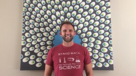 Aaron Christensen-Quick dons a scient-astic shirt at his Hillcrest apartment in this photo taken on Jan. 4, 2018. 